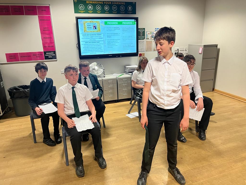 Y8 drama students acting out the tension between the Capulets and Montagues