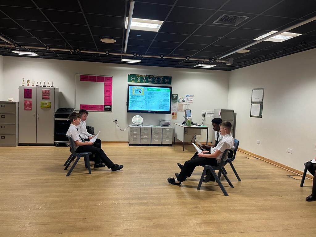 Y8 drama students acting out the tension between the Capulets and Montagues