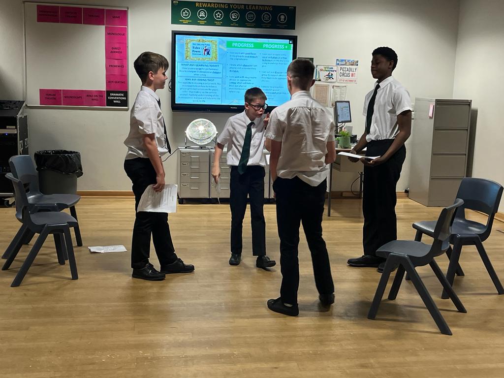 Y8 drama students acting out the tension between the Capulets and Montagues