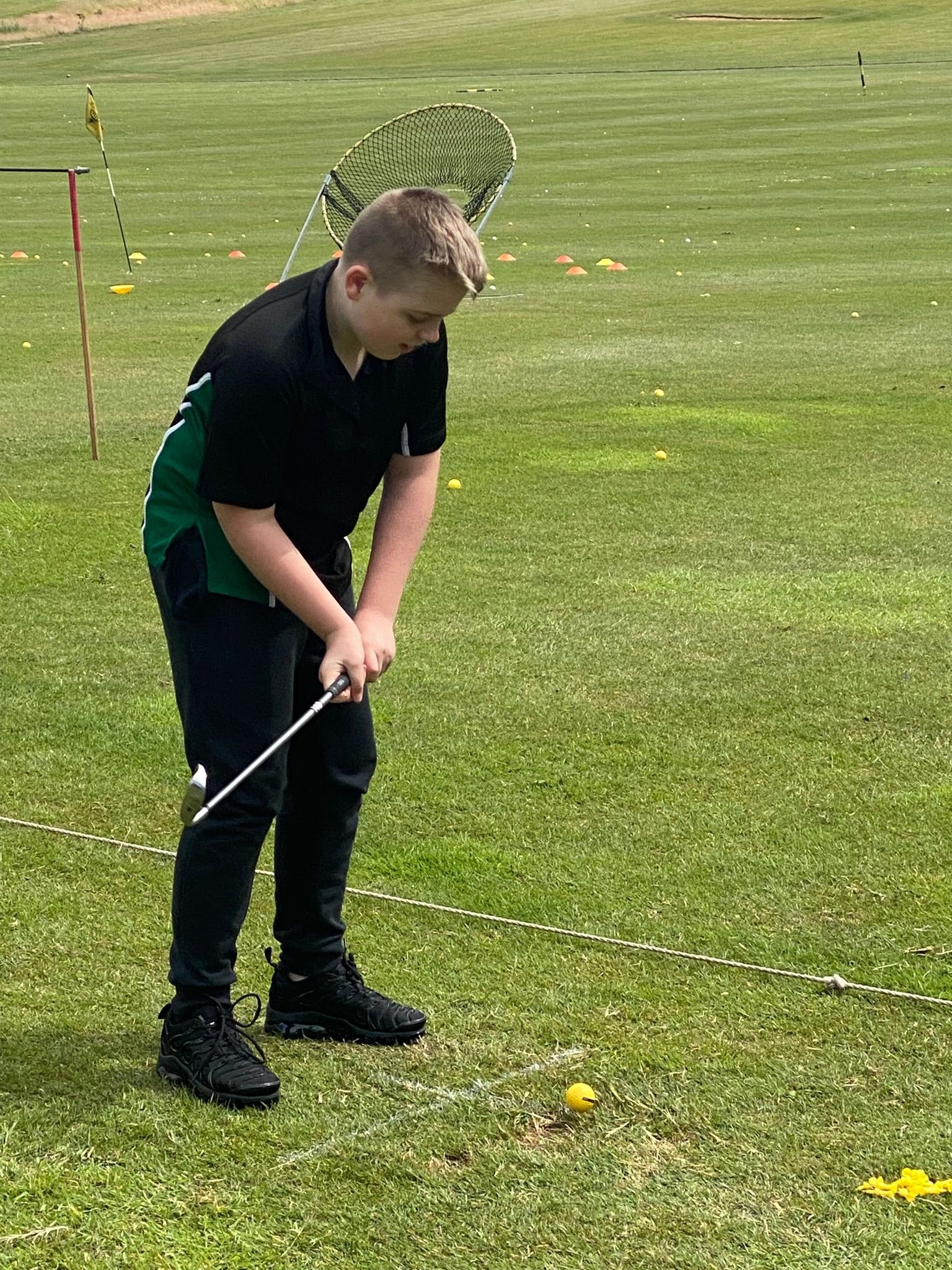 39. Students trying golf at Woolley driving range